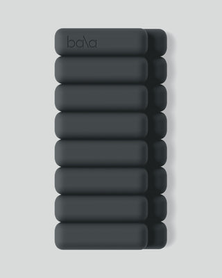 The "Vibrant Bangles Set for an Energizing Look" features ten stacked dark green bars forming a pill-shaped rectangle on a light background. The top bar displays the "bala" logo in a subtle, darker green, while rounded edges give it a sleek and modern look.