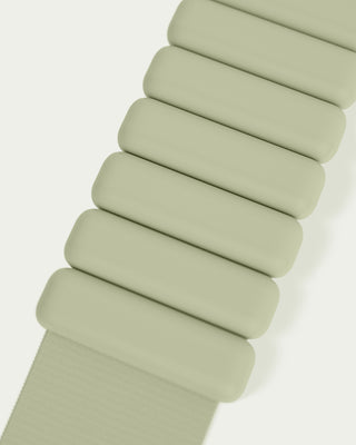 A close-up of the Vibrant Bangles Set shows a light green segmented watch band on a white background, featuring rounded rectangular links in a modern and flexible design. The bottom part transitions from a plain, continuous strap to the segmented style.